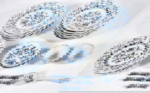Meissen Porcelain Blue Onion Pattern Dinnerware: Twenty six piece Meissen German porcelain Blue Onion pattern dinnerware grouping, cups, soup bowls and plates are signed on their underside with the word MEISSEN spelled out and a cross above, knife