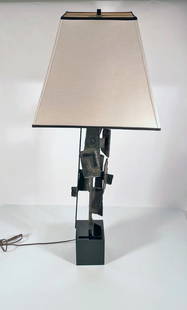 Harry Balmer for Laurel Lamp Brutalist Table Lamp: Laurel Lamp Mfg. Co. brutalist table lamp, designed by Harry Balmer, abstract steel panels fabricated and attached to center spire and mounted onto a black painted metal plinth base, unsigned, circa 1