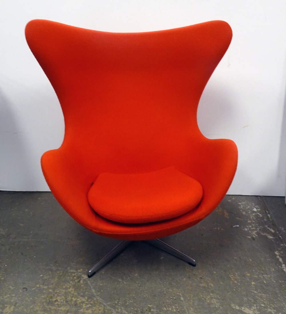 Arne Jacobsen for Fritz Hansen Inc. Egg Chair: Republic of Fritz Hansen Inc. egg chair, designed by Arne Jacobsen, red upholstery with aluminum swivel base, chair has lever and tilts, circa 2016, underside has attached Fritz Hansen Inc. labels and