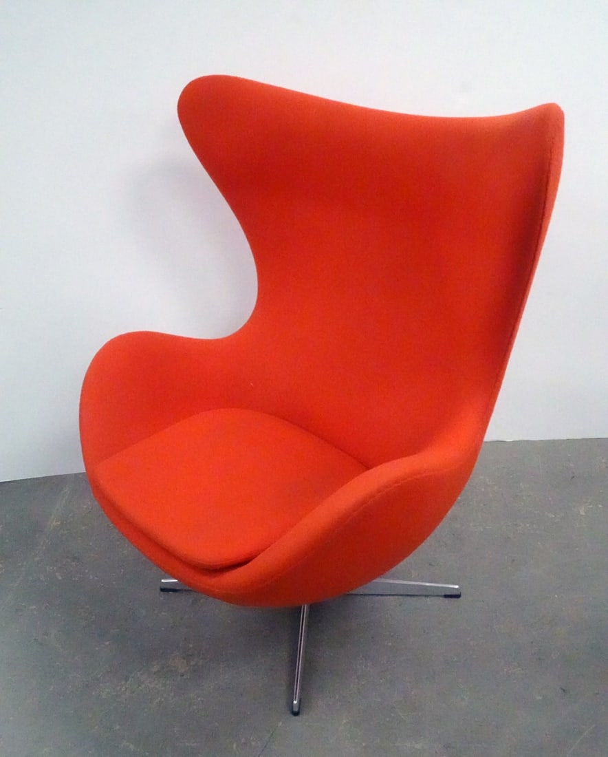 Arne Jacobsen for Fritz Hansen Inc. Egg Chair: Republic of Fritz Hansen Inc. egg chair, designed by Arne Jacobsen, red upholstery with aluminum swivel base, chair has lever and tilts, circa 2016, underside has attached Fritz Hansen Inc. labels and