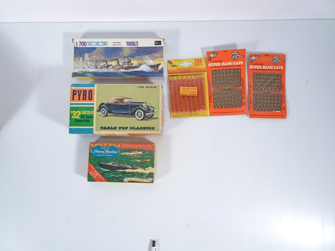 Vintage Cap Guns, Caps and Model Kits Grouping: Eleven piece vintage cap guns, caps and model kits grouping, Esquire Novelty Co. Actoy Restless .38 caliber cap gun, Larami Corp. Mauser and P-38 Z-Matic cap guns, Mattel Inc. Fanner Shootin Shell .45