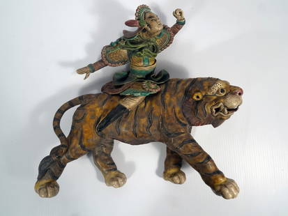 Chinese Sancai Glazed Ceramic Figural Roof Tile: Chinese multi colored Sancai glazed ceramic figural roof tile in the form of a warrior riding a tiger, unsigned, circa 20th c. Republic period, 13 7/8" (h) x 15" x 3 3/8"