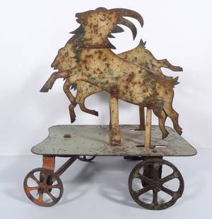 Antique Folk Art Double Goat Pull Toy: Antique Folk Art double goat pull toy, comprised of patinated sheet metal and iron wheels, unmarked, manufacturer and origin unknown, goats move up and down in a galloping motion when pulled/pushed,