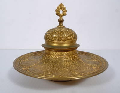 Antique French Brass Inkwell: Antique French brass inkwell, decorated with engraved Persian figures and Arabesque geometrical designs, unmarked, manufacturer unknown, comes with its original white porcelain ink holder, 5" (h) x 5