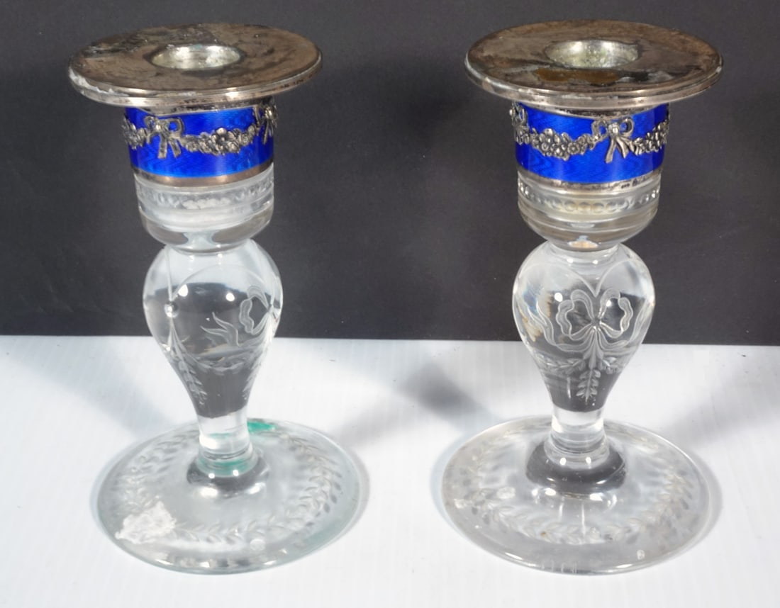Continental Silver/Enamel and Glass Candlesticks: Pair of Continental etched glass candlesticks with silver and blue enamel mount tops, applied floral ribbon band to enamel, ribbon and floral etched cutting on glass portions, signed on bottom silver