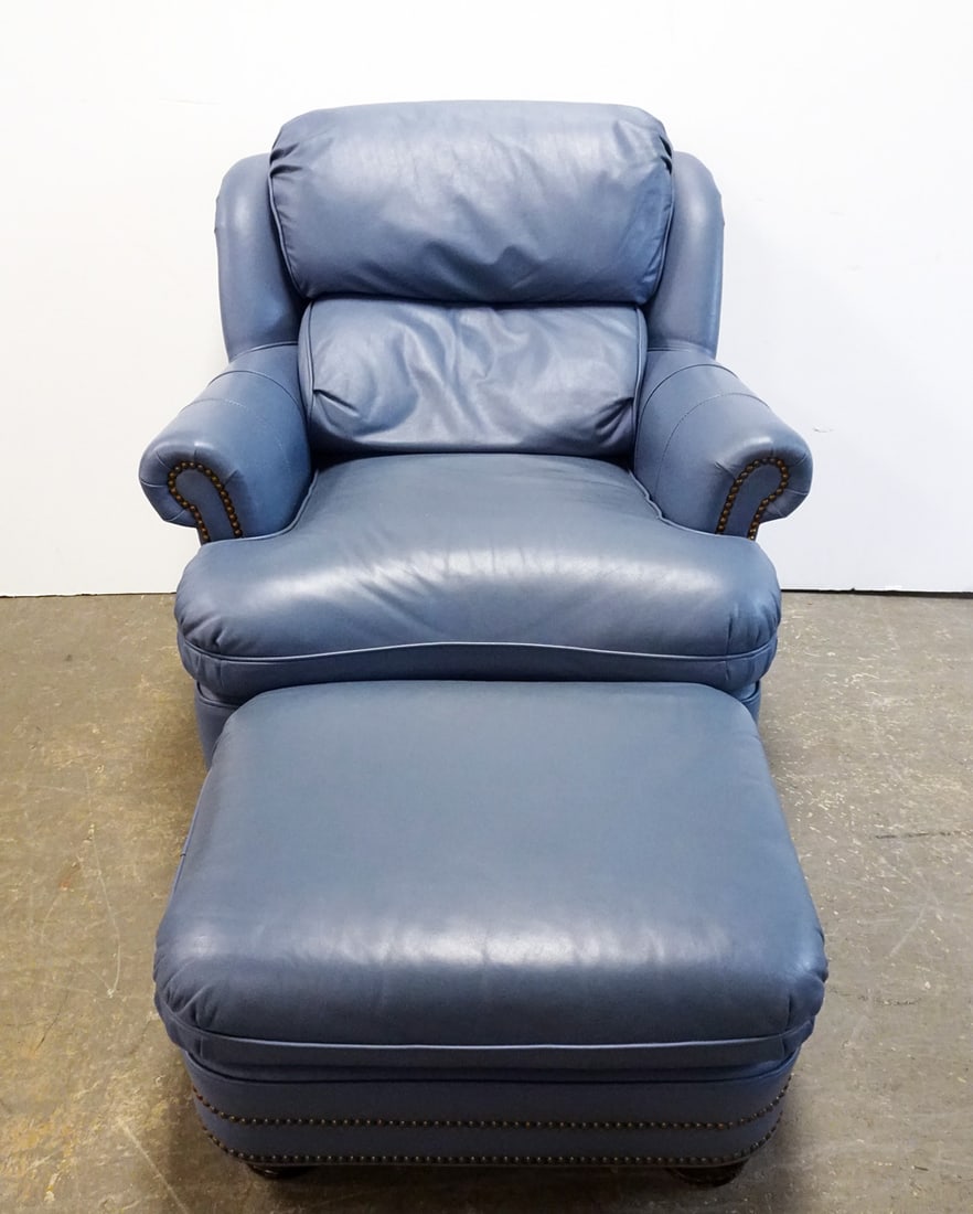Hancock and Moore Leather Chair and Ottoman: Hancock and Moore blue leather arm chair with matching ottoman, late 20th c., 32" (h) x 30" x 36 chair and 14" (h) x 26" x 22" ottoman