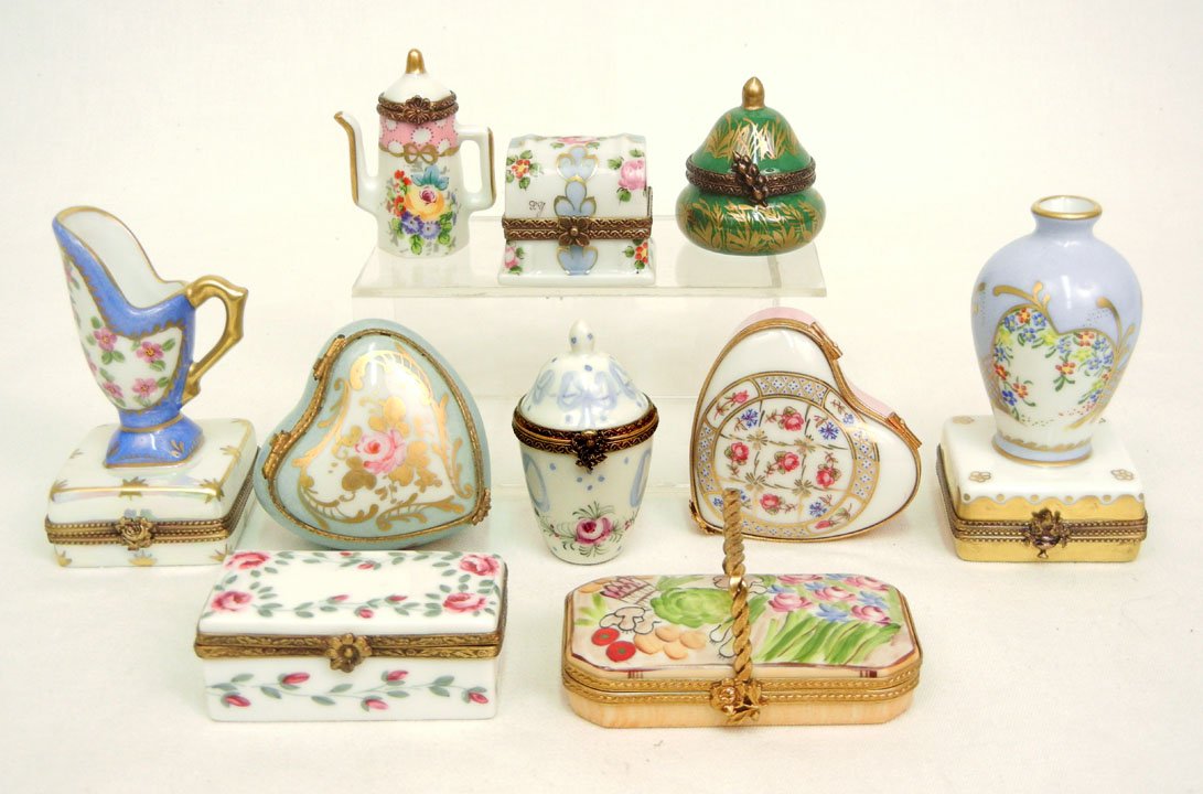 Ten Limoges porcelain pill boxes, including a baske: Ten Limoges porcelain pill boxes, including a basket, rectangular one with shoes inside, box, teapot, vase, pitcher, two urn shaped ones, and two heart shaped ones, all marked on bottom, tallest measu