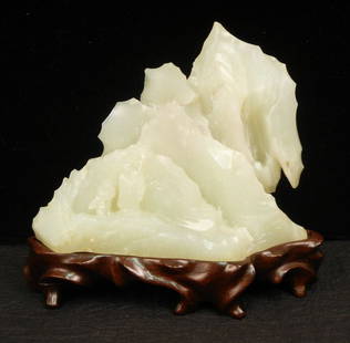 White jade mountain with Immortal and Acolyte, on: White jade mountain with Immortal and Acolyte, on fitted stand, China 18th C., 4 1/2" high x 5" across, with the appraisal from 1981.