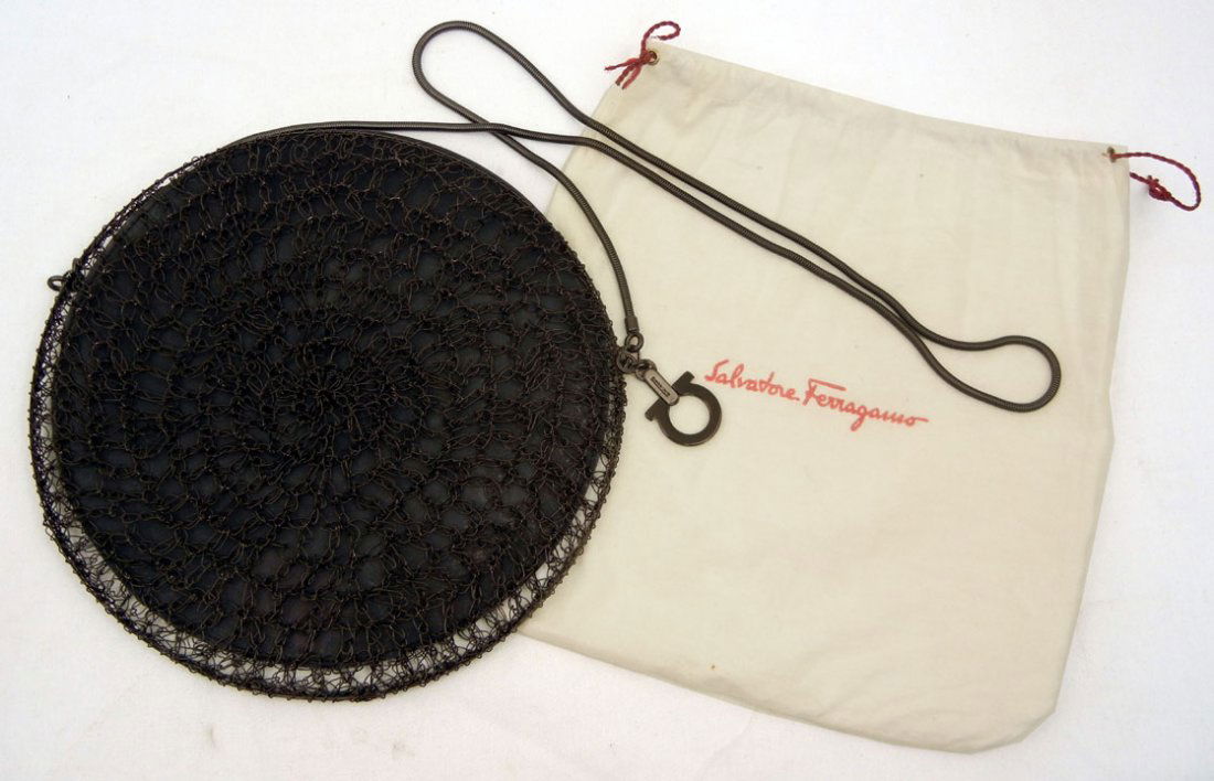 Salvatore Ferragamo round mesh purse, gun metal co: Salvatore Ferragamo round mesh purse, gun metal color, 10" diameter, 22" drop, chain handle, plastic lining, metal tag marked Ferragamo Made in Italy, includes felt bag, C. 1990