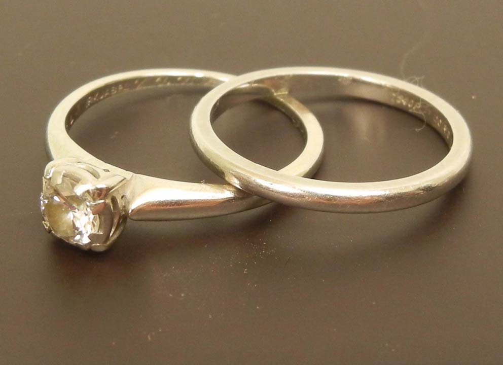 Diamond solitaire engagement ring and wedding band: Diamond solitaire engagement ring and wedding band, engagement ring is set with round diamond measuring approximately 0.40 carats in 18K white gold mounting, marked 18K Jabel, wedding band marked plat