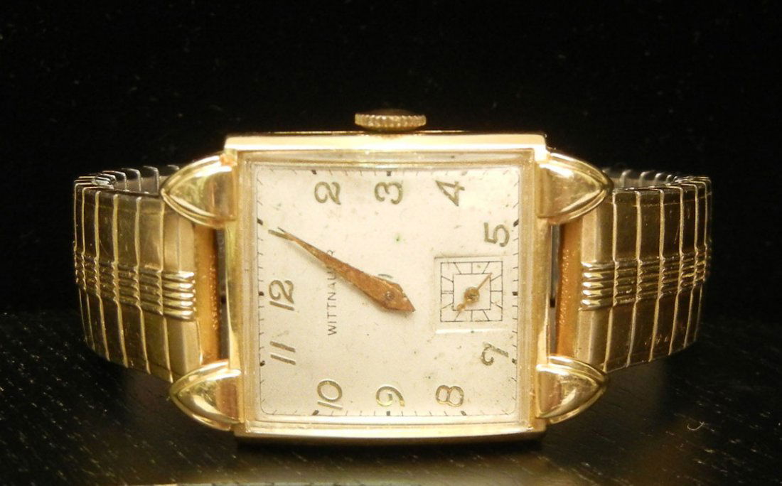 Man's Wittnauer 14K gold cased wristwatch, 17 jewe: Man's Wittnauer 14K gold cased wristwatch, 17 jewel movement, case measures 1 3/8" long x 1" wide, Speidel flex band, case marked inside 14K #12022, mid 20th C.