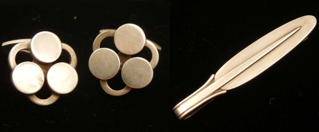 Hans Hansen sterling silver cufflinks, modernist d: Hans Hansen sterling silver cufflinks, modernist design, 3/4" diameter, marked 925S Denmark, 625, hallmark for Hans Hansen, weight 23.6 grams, mid 20th C., and a Georg Jensen sterling silver tie bar,
