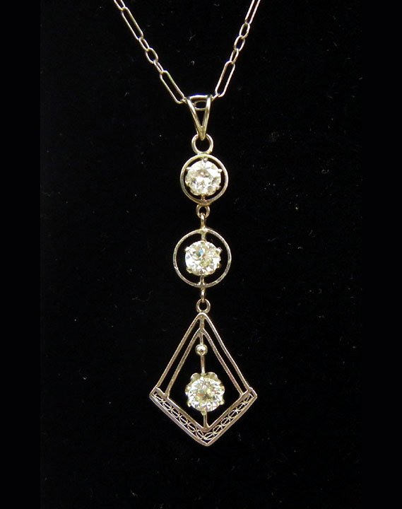 Edwardian gold and diamond necklace with center dr: Edwardian gold and diamond necklace with center drop, 14K white gold, set with three mine cut diamonds measuring approximately 0.25 carats each in buttercup mountings, 16" long 14K fancy link chain, w