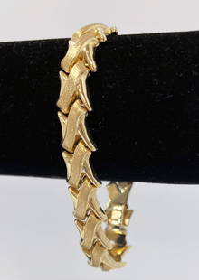 14K Gold X Bracelet: 14K gold X bracelet, with a brushed and polished finish, 7" in length, 10mm width, stamped 14kt Italy, 12.8 grams