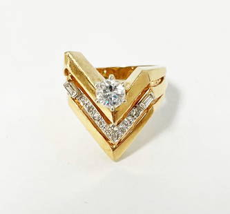 14K Gold Diamond Ring: 14K gold diamond ring, V form with 60 pt center diamond, two 8 pt. baguette diamonds, and eight 3 pt. diamonds, 1 ct. total ct. weight, stamped GAN, tests 14k, 9.6 grams total weight, size 7