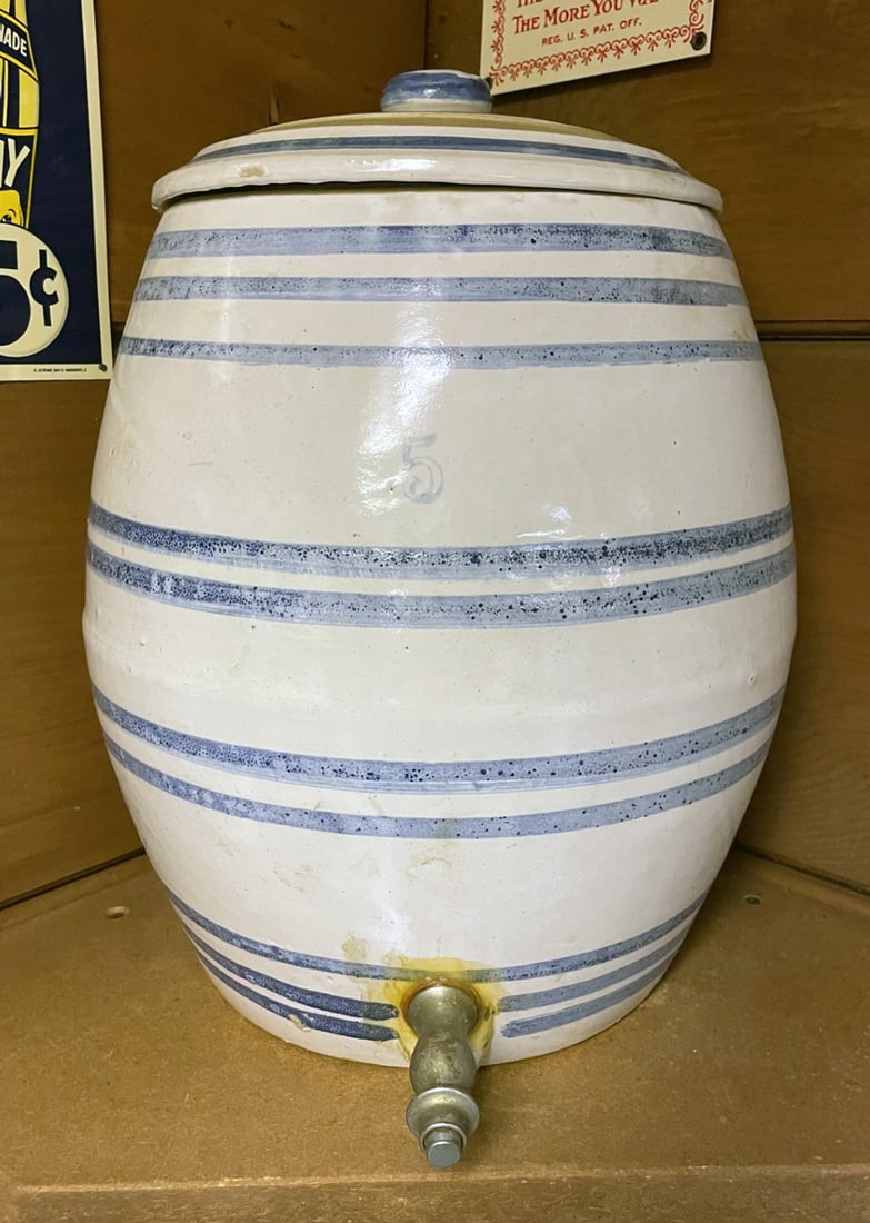 Blue Decorated Stoneware Water Dispenser: Blue decorated stoneware 5 gallon water dispenser with its original metal spout, unmarked, manufacturer unknown, 16" (h) x 12" x 12"