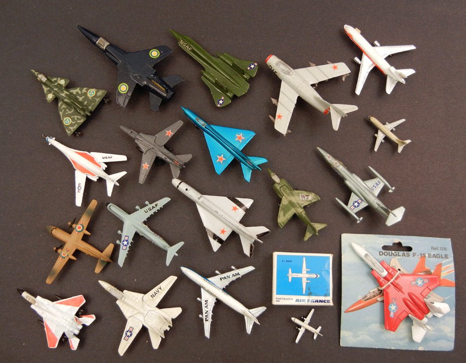 Grouping of nineteen small die cast toys, including Zyl: Grouping of nineteen small die cast toys, including Zylmex, Made in Hong Kong, "Matchbox" by Lesney, Schabak, Pilen, Playme Douglas F-15 Eagle in package