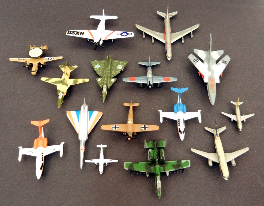 Grouping of fifteen die cast toys, including Zylmex, "M: Grouping of fifteen die cast toys, including Zylmex, "Matchbox" by Lesney, Lintoy, Made in Hong Kong, Grumman "Bearcat" Fairchild Republic, Pilen, Made in W.Germany
