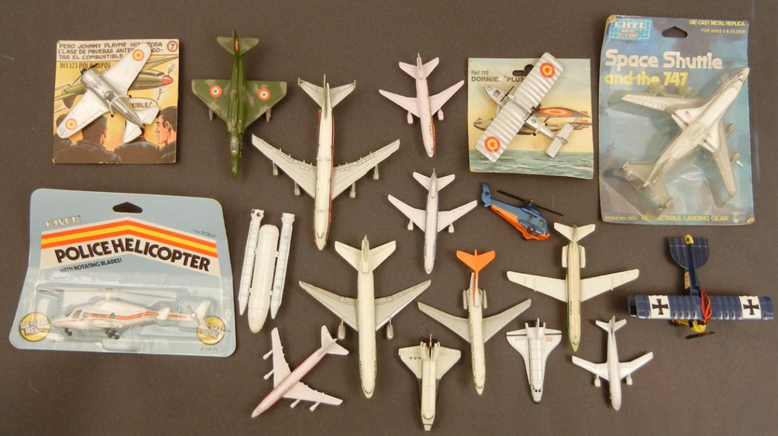 Grouping of eighteen diecast metal aircrafts, including: Grouping of eighteen diecast metal aircrafts, including Lintoy Douglas DC-10, Lintoy Boeing 747, Hong Kong, A-4F Skyhawk, Lintoy Boeing 727, Matchbox Seasprite, Edison Hansa Brandenburg, two Ertl's in