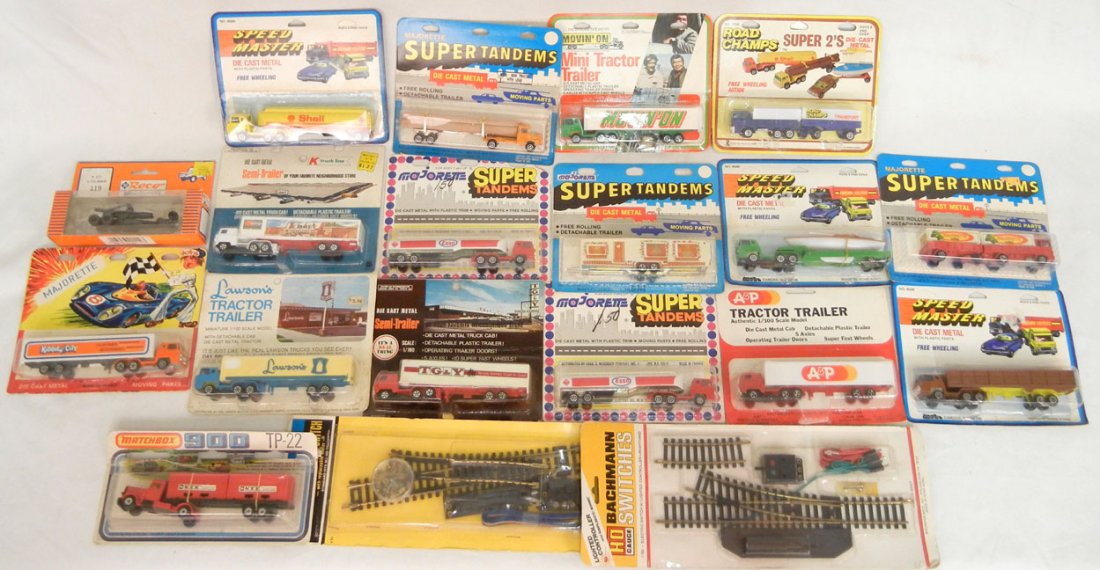 Grouping of thirty-two diecast vehicles, including Spee: Grouping of thirty-two diecast vehicles, including Speed Master, Majorette, Road Champs, advertising trucks, Coca-Cola, Kmart, Howard Johson, Matchbox, Model Power, and Bachmann HO gauge switches