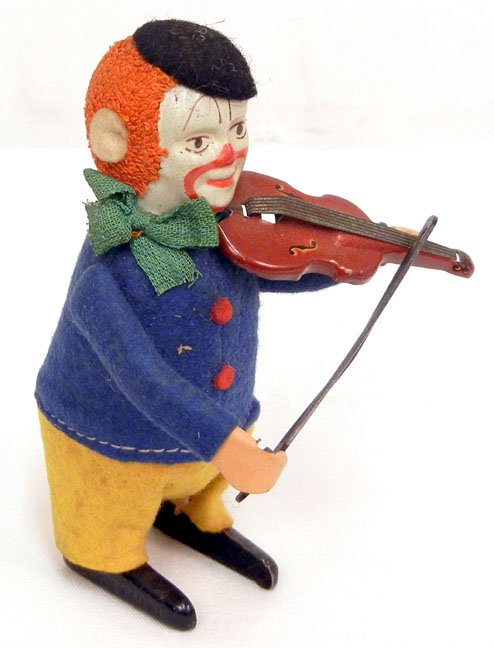 Schuco tin and cloth wind-up Clown Playing Violin, imp: Schuco tin and cloth wind-up Clown Playing Violin, impressed Made in Germany and Schuco Patent on feet, missing key, 4 1/2" high