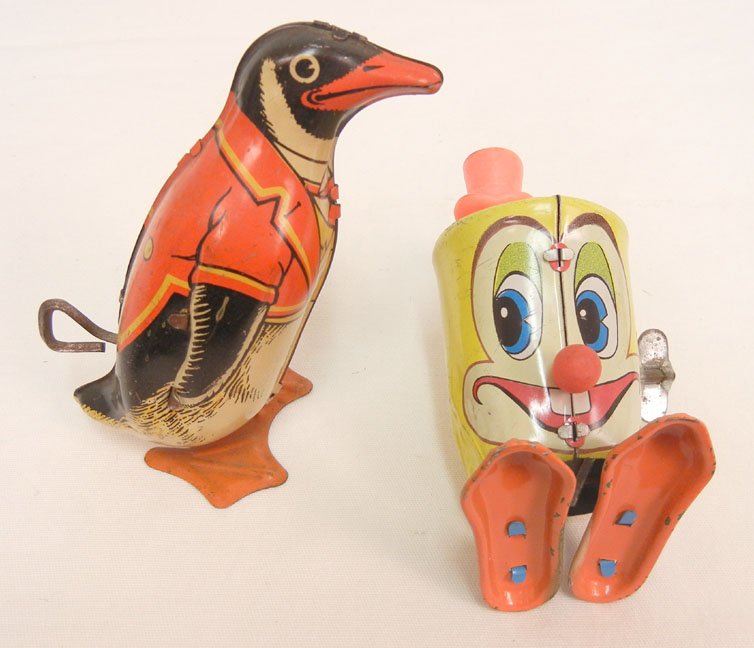 Two tin litho wind-up toys, J. Chein penguin, 4", and M: Two tin litho wind-up toys, J. Chein penguin, 4", and Marx D. Dean saxaphone, 4", both working