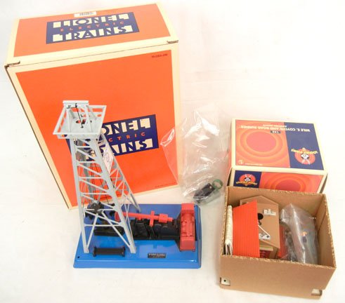 Lionel Oil Derrick and Lionel Looney Tunes Wile E. Coyo: Lionel Oil Derrick 6-12930, and Lionel Looney Tunes 145 Wile E. Coyote and Road Runner Ambush Shack 6-12955, both mint in boxes, unassembled, modern O gauge