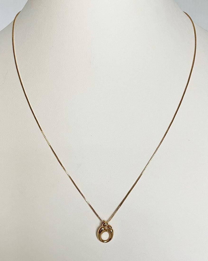 14K Gold Necklace with Mother and Child Pendant: 14K gold necklace with mother and child pendant, 18" chain with lobster claw catch stamped 14KT Italy 1 CL, 15mm pendant stamped 14K Kaynar 3.2 grams total weight