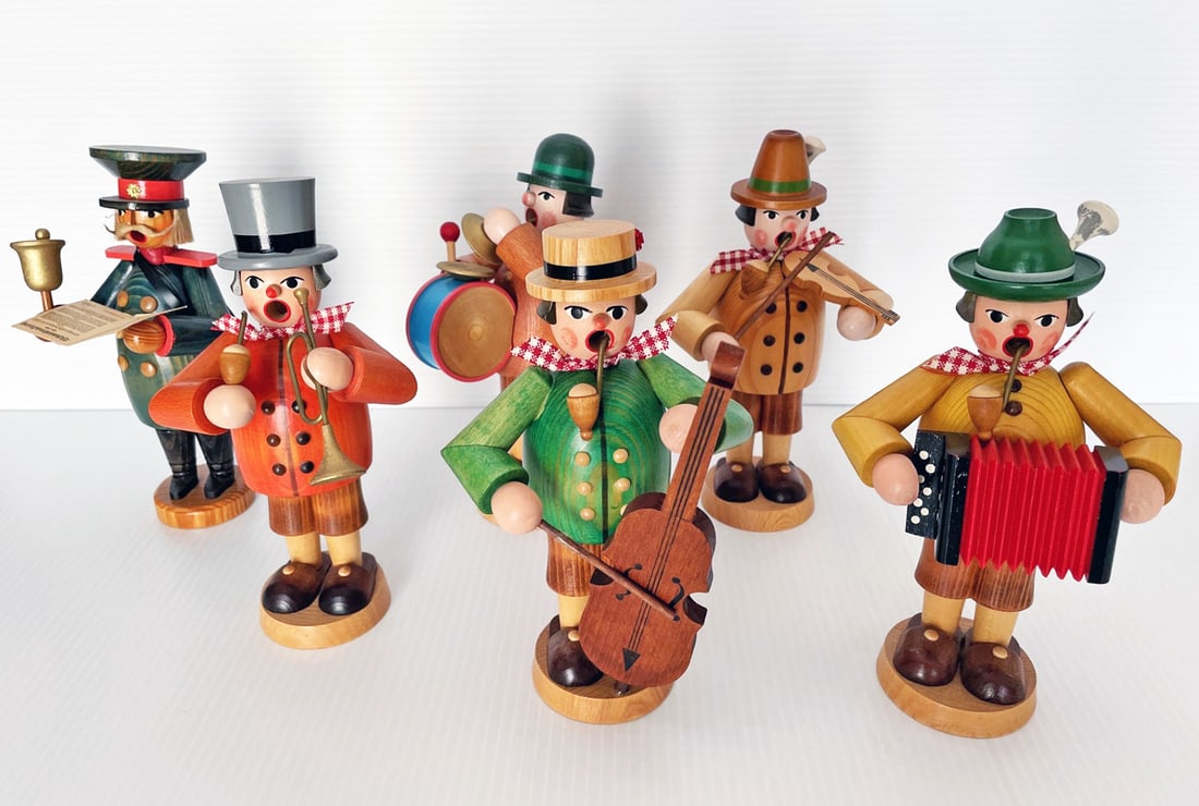 Six Erzgebirge German Incense Smokers: Six Erzgebirge German incense smokers, all with labels on bottom Erzgebirge Made in German Democratic Republic, five figures playing musical instruments, one holding sheet music and singing, all 7" to