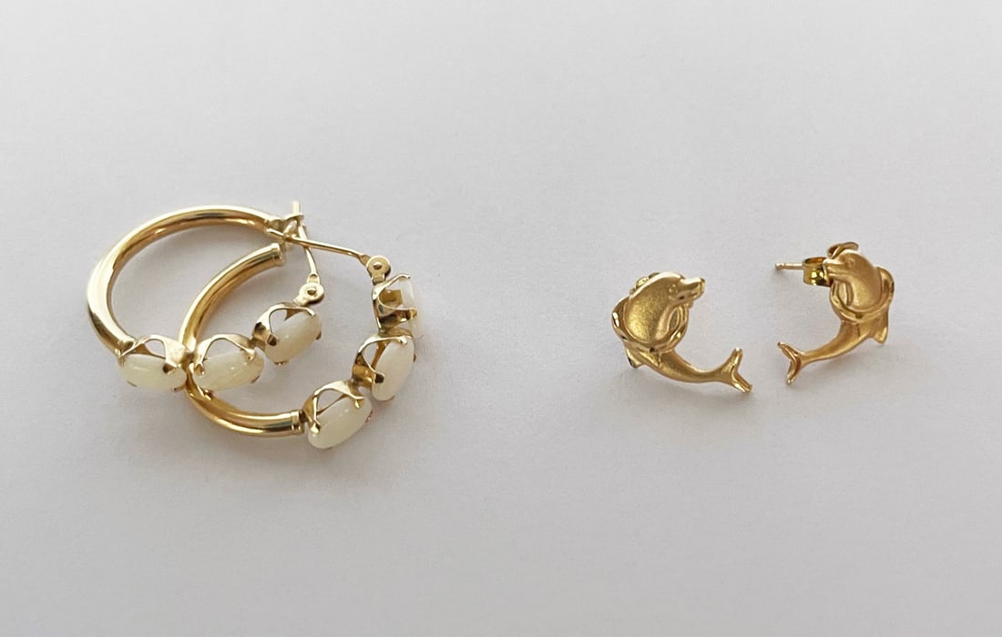 Two Pairs of 14K Gold Earrings: Two pairs of 14k gold earrings, includes three opal and hollow gold hoops stamped S 14K 20mm diameter, 14mm dolphins stamped 14K on backs .4 grams, 1.8 grams total weight