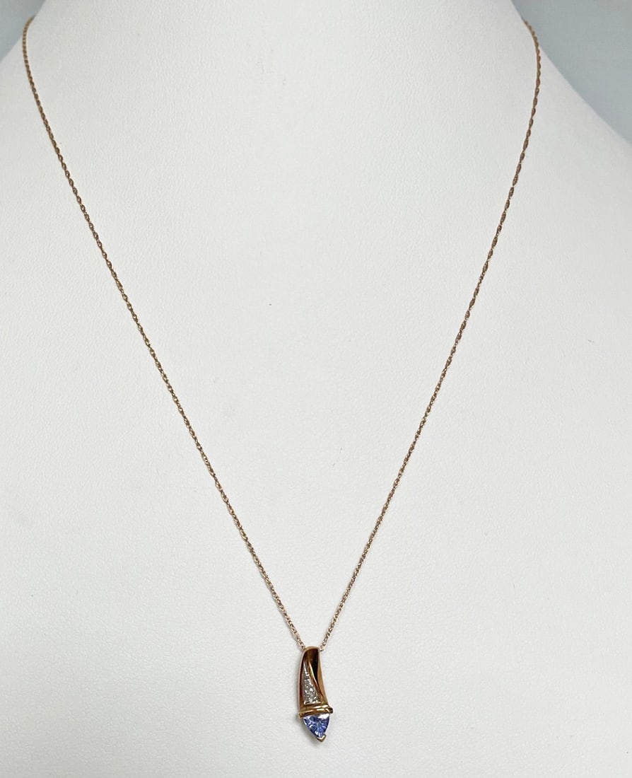 10K Gold Chain with 10k Gold and Tanzanite Pendant with Diamonds: 10K gold 18" chain with 10k gold and tanzanite 15mm pendant with diamonds, both stamped 10k with maker's stamp, 1.3 grams t.w.