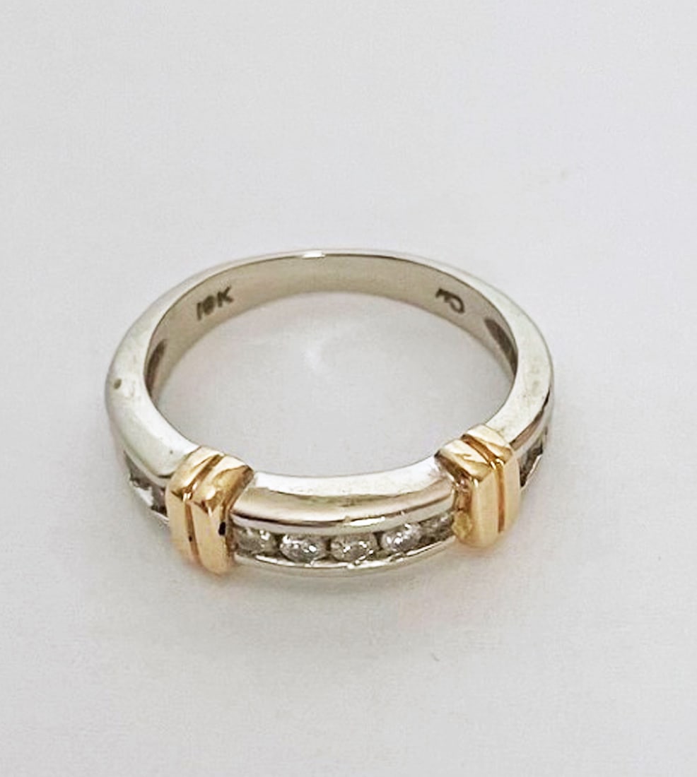 10K White and Yellow Gold Diamond Ring: 10K white and yellow gold diamond ring, nine approx. 3 pt. diamonds, yellow gold vertical banding, 5mm high, 3.0 grams, size 5 1/2
