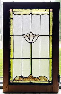 Antique Leaded Stained Glass Window: Antique leaded stained glass window, center with opaque white and tortoise shell colored single flower surrounded by ice finished clear glass panels with amber colored glass border, circa early 20th c