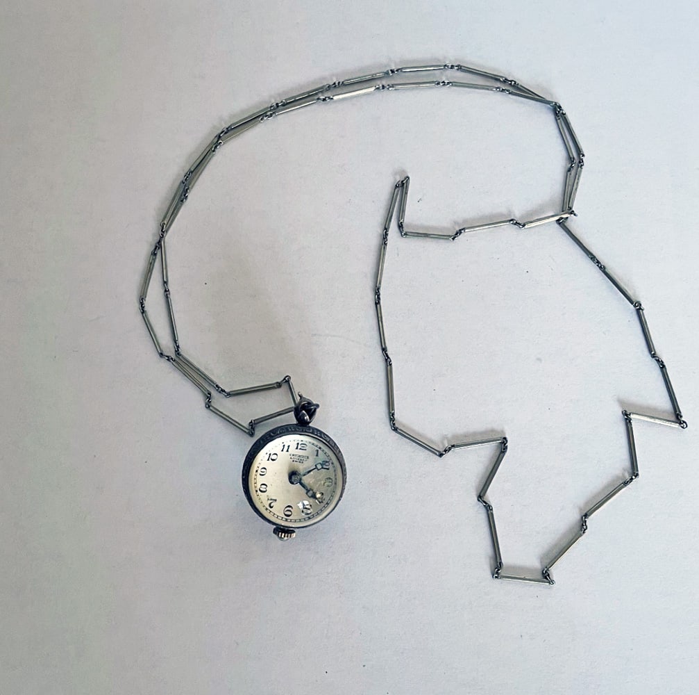 C. Bucherer Swiss Ball Skeleton Watch: C. Bucherer Swiss ball skeleton watch with exhibition movement on 31" metal chain, 22mm x 30mm, not working