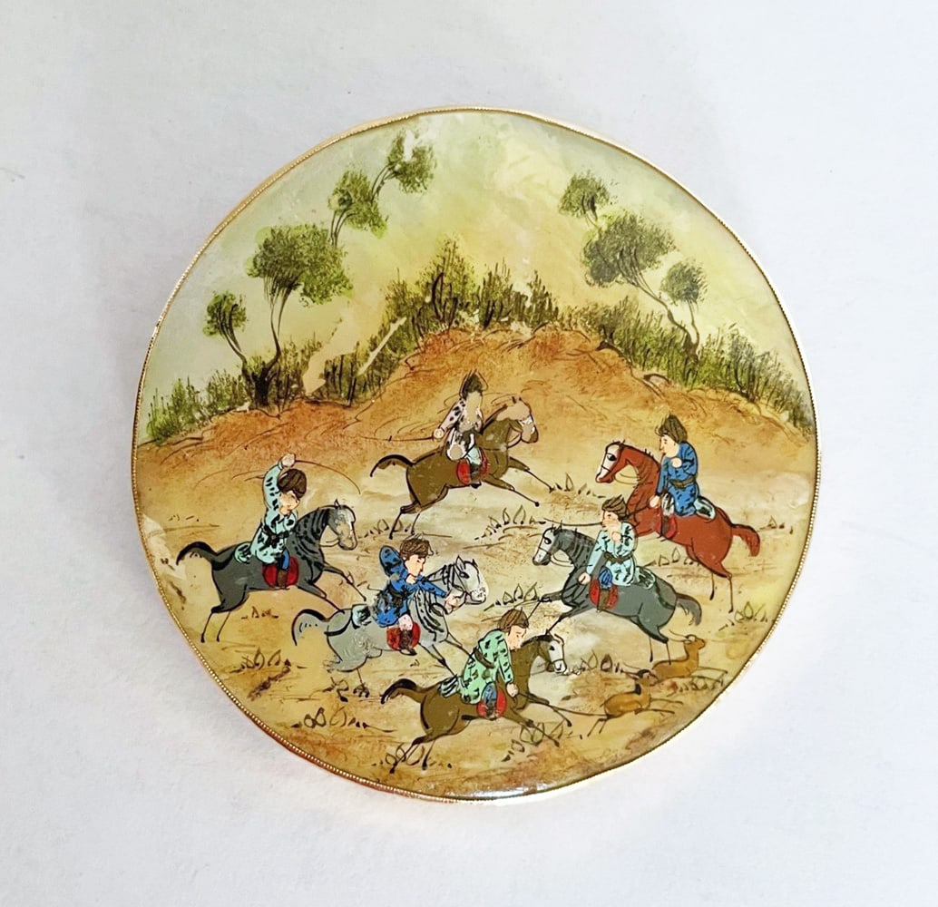 14K Gold Hand Painted Persian Mughal Brooch: 14K gold and hand painted on mother of pearl Persian Mughal brooch/pendant; scene of deer hunting riders on horseback in landscape; bezel, pin back and hinged pendant bale test 14K gold; 2 1/2" diamet