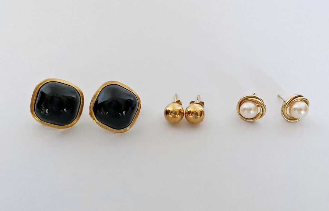 Three Pairs of 14k Gold Earrings: Three pairs of 14k gold earrings, includes square shaped black onyx worn on a diagonal, 7/8" wide, pierced Omega backs, stamped 14k/585, 8mm ball posts, posts and butterfly backs stamped 14k, and 7mm
