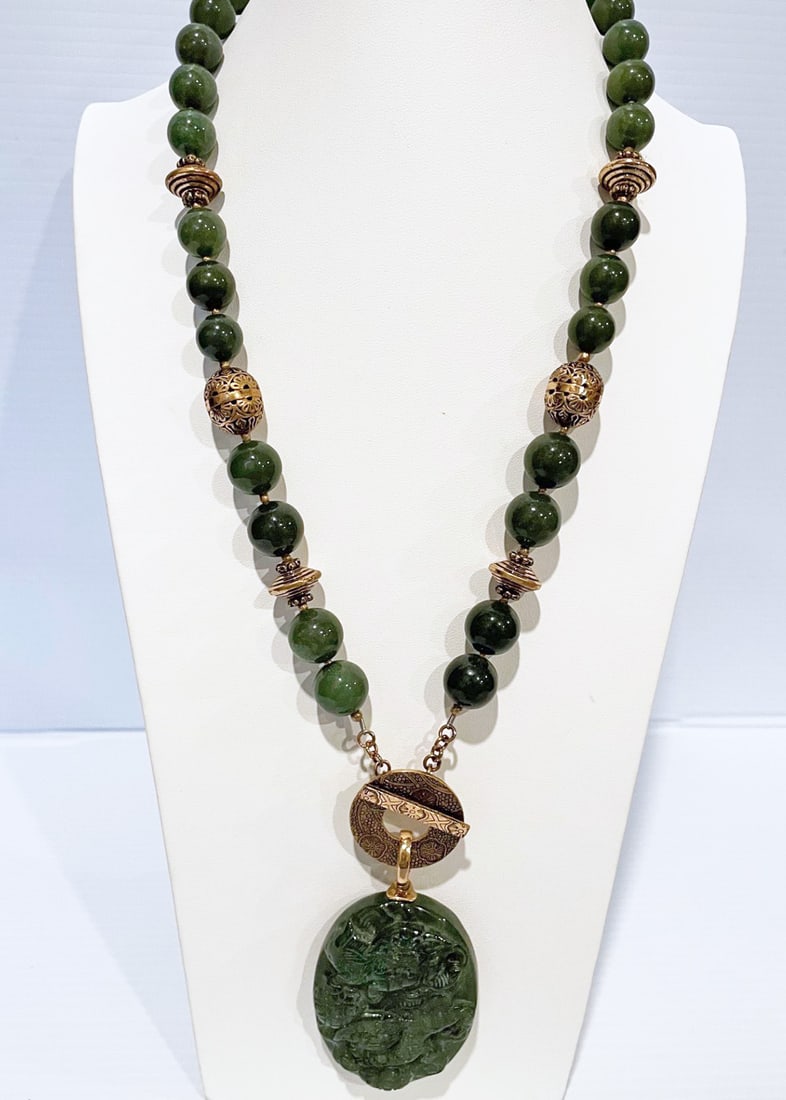 Signed AKR Green Stone Bead Necklace: Signed AKR green stone bead necklace, 14mm beads with 2 1/2" long carved green stone removable pendant, necklace is 24" long (not including pendant), bronze toggle clasp stamped Bronze AKR, for Amy Ka
