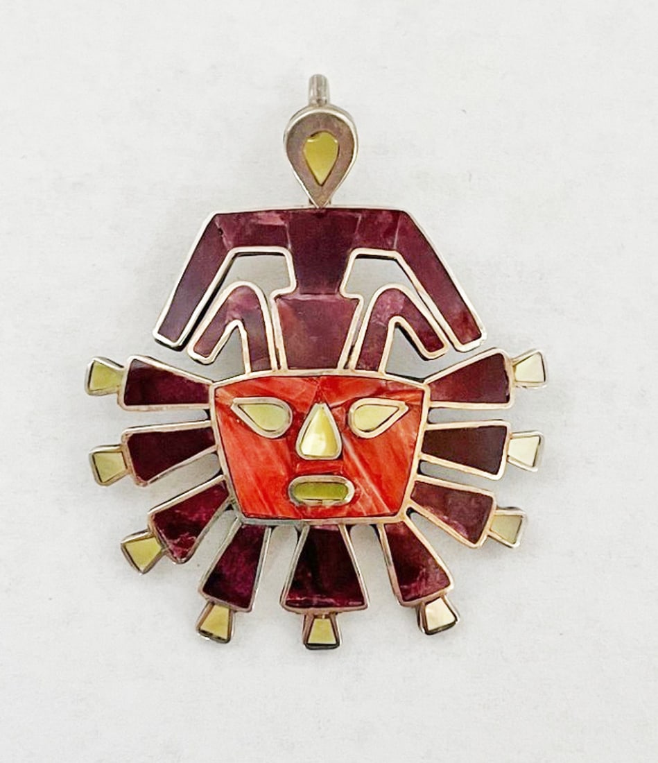 Mexican Sterling Silver Mask Pendant with Inlay: Mexican sterling silver mask pendant with inlay, Pre-Columbian design mask inlaid with spiny oyster and mother of pearl, 1 3/4" long, stamped 950, weight 7.8