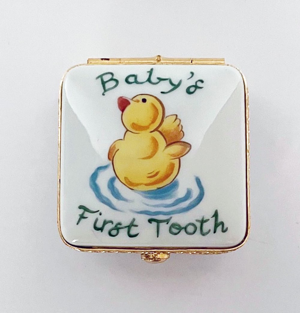 Tiffany & Co. Limoges Porcelain Hinged Box: Tiffany & Co. Limoges porcelain hinged box, hand painted "Baby's First Tooth" with yellow duck, blue Tiffany bow on back and signed "Tiffany & Co. Hand Painted Made in France" with Limoges mark, measu