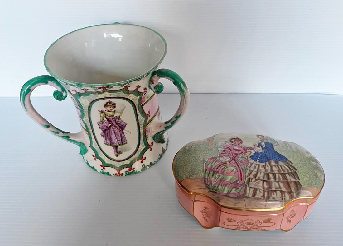 Two Porcelain Pieces: Three handled vase with Belle Epoch female figure on front, hand painted 6 1/2" high, and a covered dresser jar with female figures on lid 3" high x 7" x 4 1/2", both unmarked