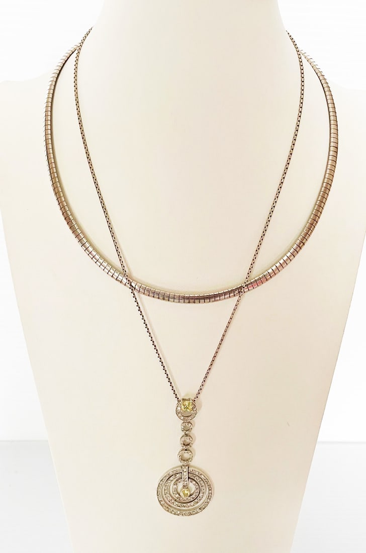 Two Italian Sterling Silver Necklaces: Two Italian Sterling Silver Necklaces, includes Omega style collar necklace, 18 1/2" long x 5mm wide, stamped Milor 925 Made in Italy; and tiered rings pendant with C.Z.'s, 2 5/8" long, on 20" elongat