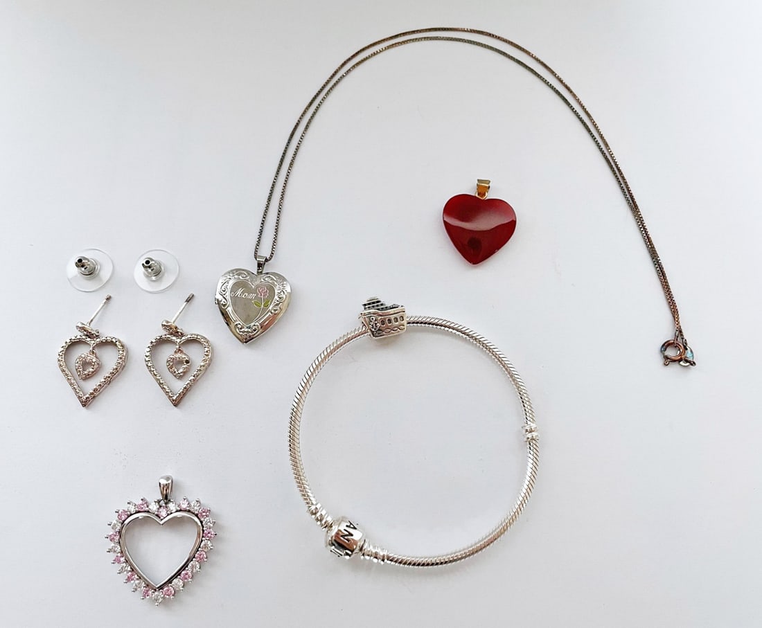 Sterling Silver Jewelry Lot: Sterling silver jewelry lot, includes heart locket engraved "Mom" on 18" chain, C.Z. heart pendant and pierced earrings, carnelian heart with vermeil bale, and Pandora bracelet with tugboat charm, sta