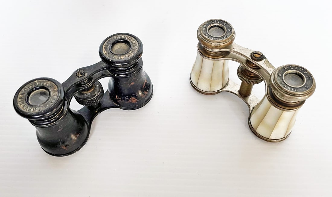 Two Pairs of French Opera Glasses in Cases: Two pairs of French opera glasses in cases, one mother of pearl, 3 3/4" x 2 1/4", marked H. Lamy Ft Paris, kid leather case, and one with black finish, 4" x 2", marked Chevalier Optiticien Paris, blac
