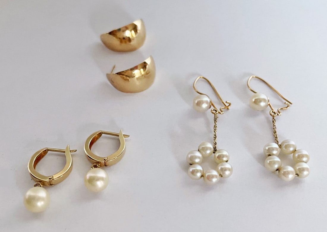 Three Pairs of 14k Gold Earrings: Three pairs of 14k gold earrings, includes small tapered half hoops, 5/8" long, marked 14k, small hoops with 7mm pearls, 7/8" long, unmarked, tests 14k, and one pair of pearl dangle earrings, 2 3/4" l