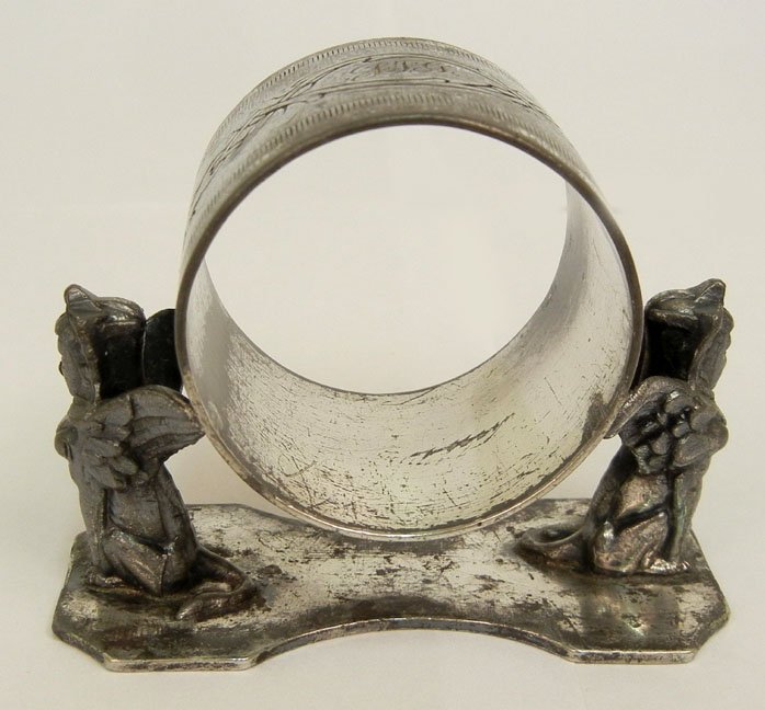 Victorian figural silver plated napkin ring by Meriden : Victorian figural silver plated napkin ring by Meriden Silver Co., two sphinxes supporting ring with wings, impressed Meriden Silver Plate Co. 202 on bottom, late 19th C., 2 1/4" high