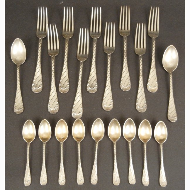 Partial set of Austrian sterling silver flatware, inclu: Partial set of Austrian sterling silver flatware, including nine 7" forks, two 5 7/8" teaspoons, and nine 4 3/8" demitasse spoons with gold wash in bowls, hallmarked, late 19th C., 20.610 troy oz.