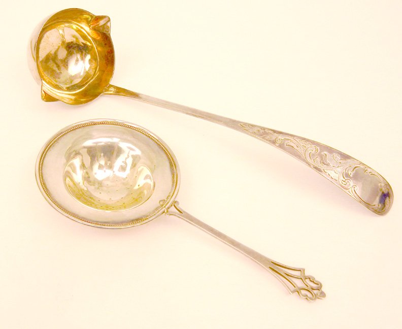 Sterling silver soup ladle and tea strainer, Geo. W. We: Sterling silver soup ladle and tea strainer, Geo. W. Webb sterling silver soup ladle with engraved handle and gold wash in bowl, 10", and a sterling tea strainer with pierced handle 7 1/4", 4.950 troy