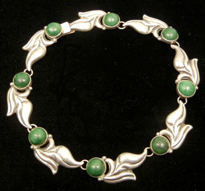 Anton Mexican sterling silver and green stone necklace,: Anton Mexican sterling silver and green stone necklace, eight sections measuring 2" each with round green stone, possibly onyx, 16 1/2" long, marked Anton Sterling Mexico, weight 59 grams, ca. 1940