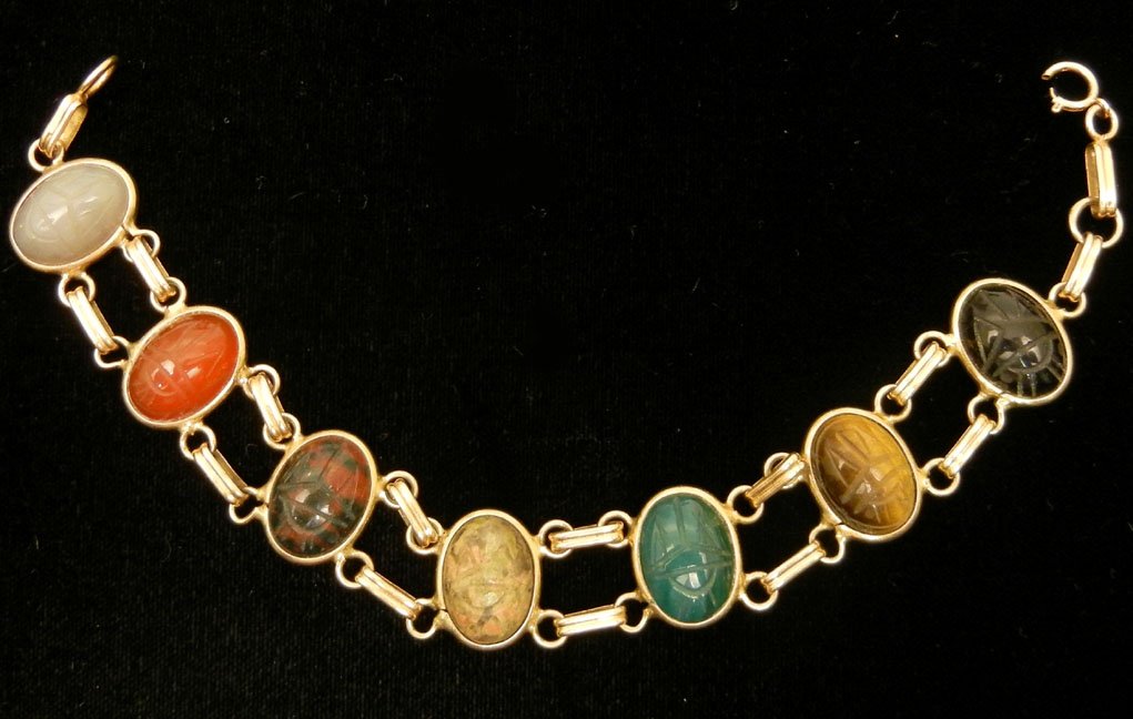 Gold scarab bracelet, 14k gold double link, stones set : Gold scarab bracelet, 14k gold double link, stones set horizontally, semi-precious stones include black onyx, tiger's eye, crysophase, carnelian and agate, 1/2" wide, 7 3/4" long, marked 14k, weight 1