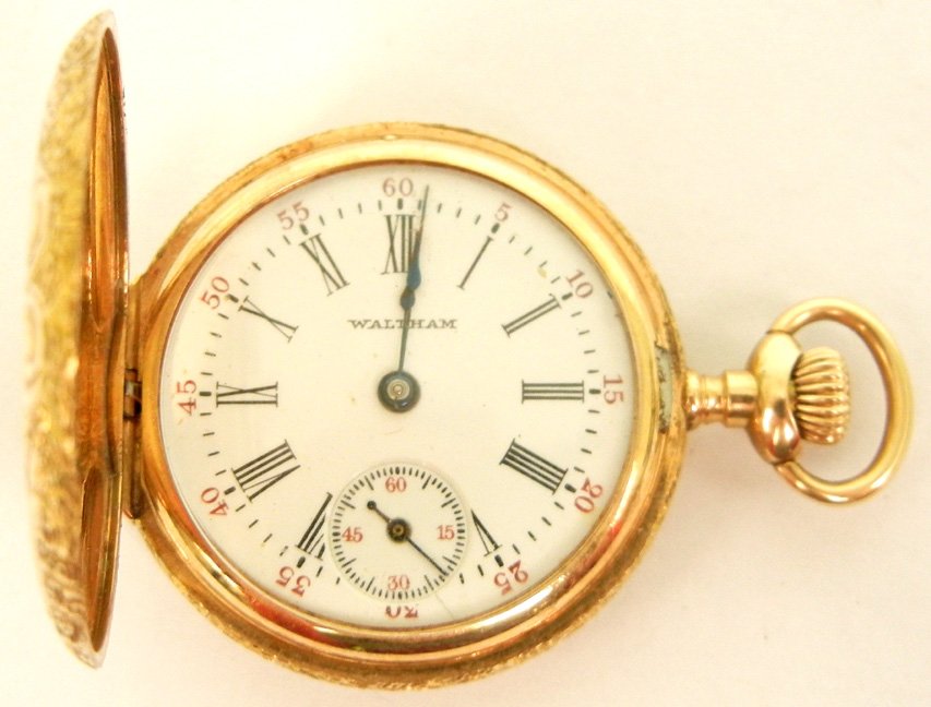 Lady's 14k gold cased pocket watch, hunting case with A: Lady's 14k gold cased pocket watch, hunting case with Art Nouveau chased design on front and back, Roman numeral dial, marked 14k ROY, works marked A.W.W. Co. Waltham Mass. Sapphire 14170802, early 20